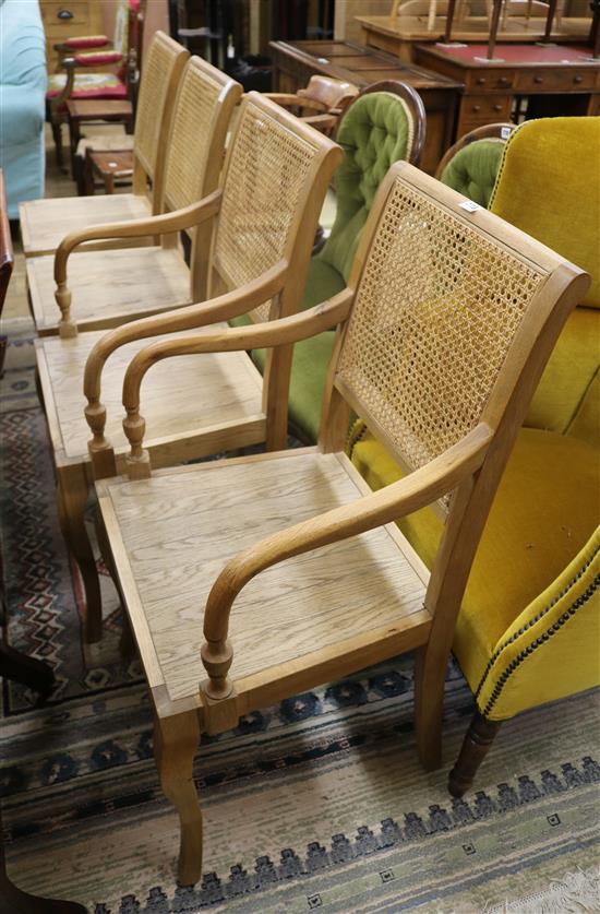 A set of 4 oak and cane dining chairs